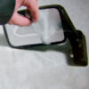SPERIC_6-1 Immagine ravvicinata della superficie adesiva dello specchio deformabile prima dell'applicazione.