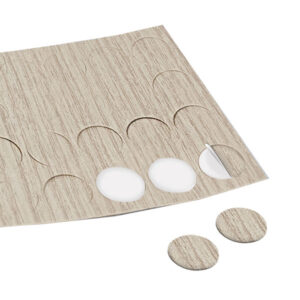 VTE138_1-1 Dettaglio ravvicinato delle cover adesive rovere sbiancato • Ø 13 su una superficie in legno chiaro, evidenziando la finitura.