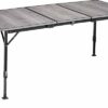 Tavolo Elùtop ComPack Extension aperto in ambiente esterno per campeggio.